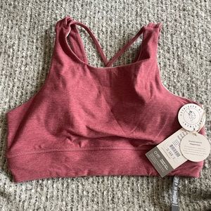 Brand new vuori elevation bra in desert rose heather. Size medium